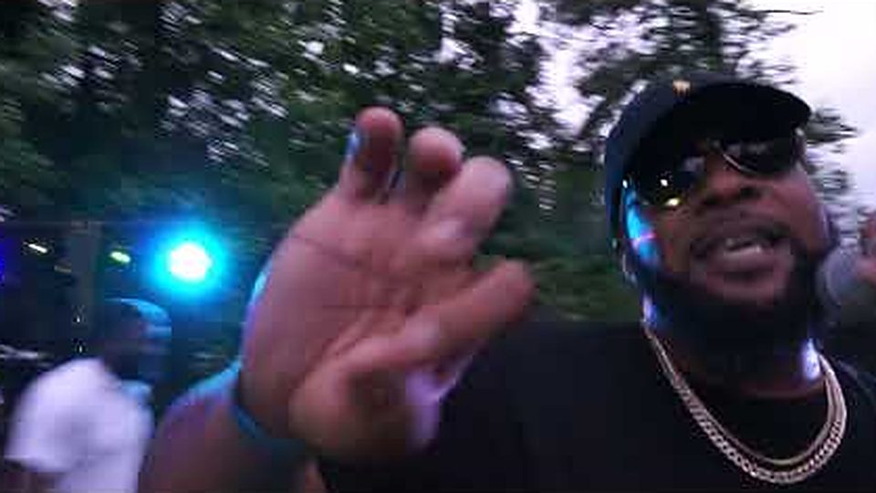 Still from the Good Vybez Only video: Big Sacc performing outdoors at night